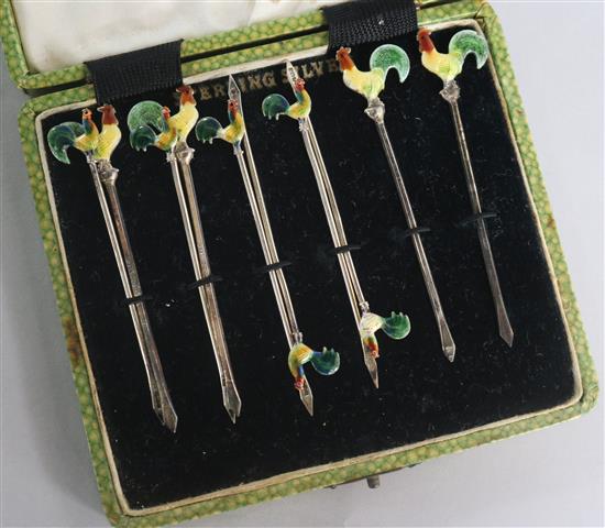 A set of ten sterling silver and enamel cocktail sticks with cockerel terminals.